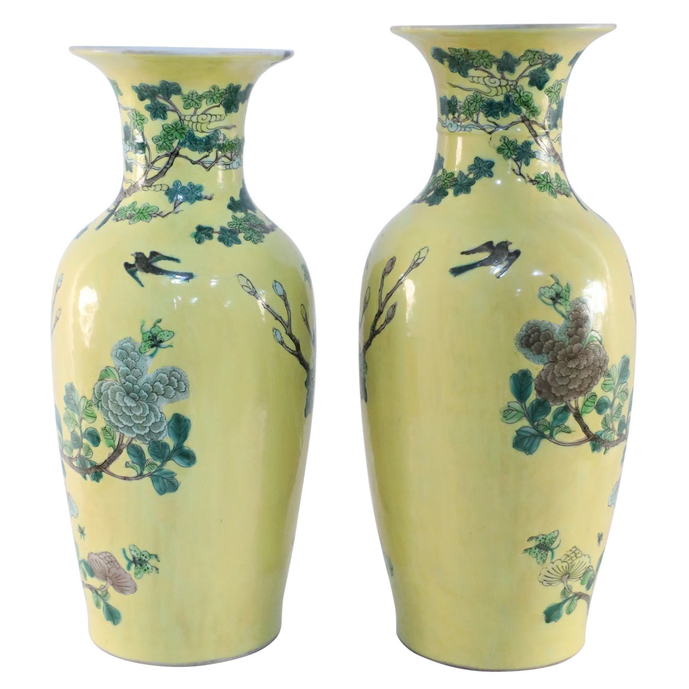 Pair of antique Chinese (19th century) export porcelain porcelain vases with a yellow ground wrapped in large scale branches teeming with birds, flowers and foliage (priced as pair).
    