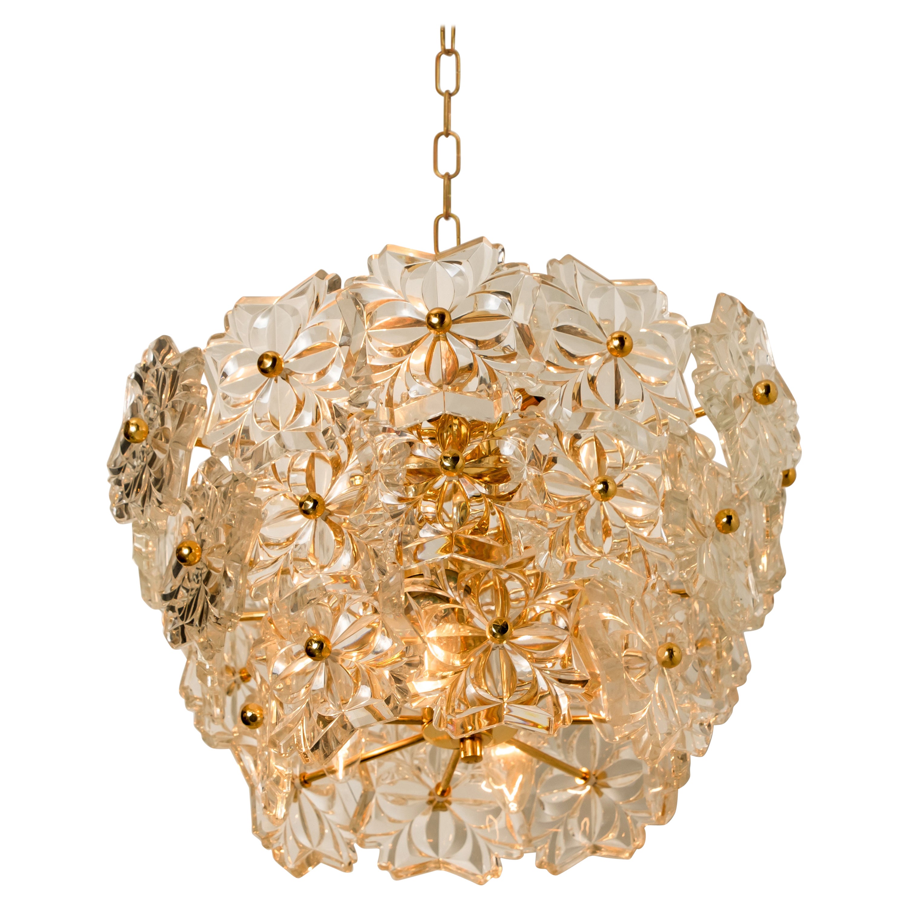 one f the two sculptural chandelier has the design of a bouquet of textured glass flowers and are from the historical lighting company Hillebrand, manufactured in midcentury, circa 1970 (late 1960s or early 1970s).

The fixture has several flower