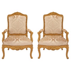 Pair of French Early 19th Century Louis XV St. Giltwood Armchairs