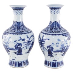 Pair of Chinese Qing Dynasty White and Blue Figurative Scene Porcelain Vases