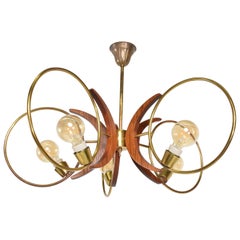 Alluring Five Ring Sculptural Chandelier in Brass and Mahogany Mexico City 1960s