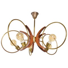 1960s Alluring Five Ring Sculptural Chandelier Brass and Mahogany Mexico City