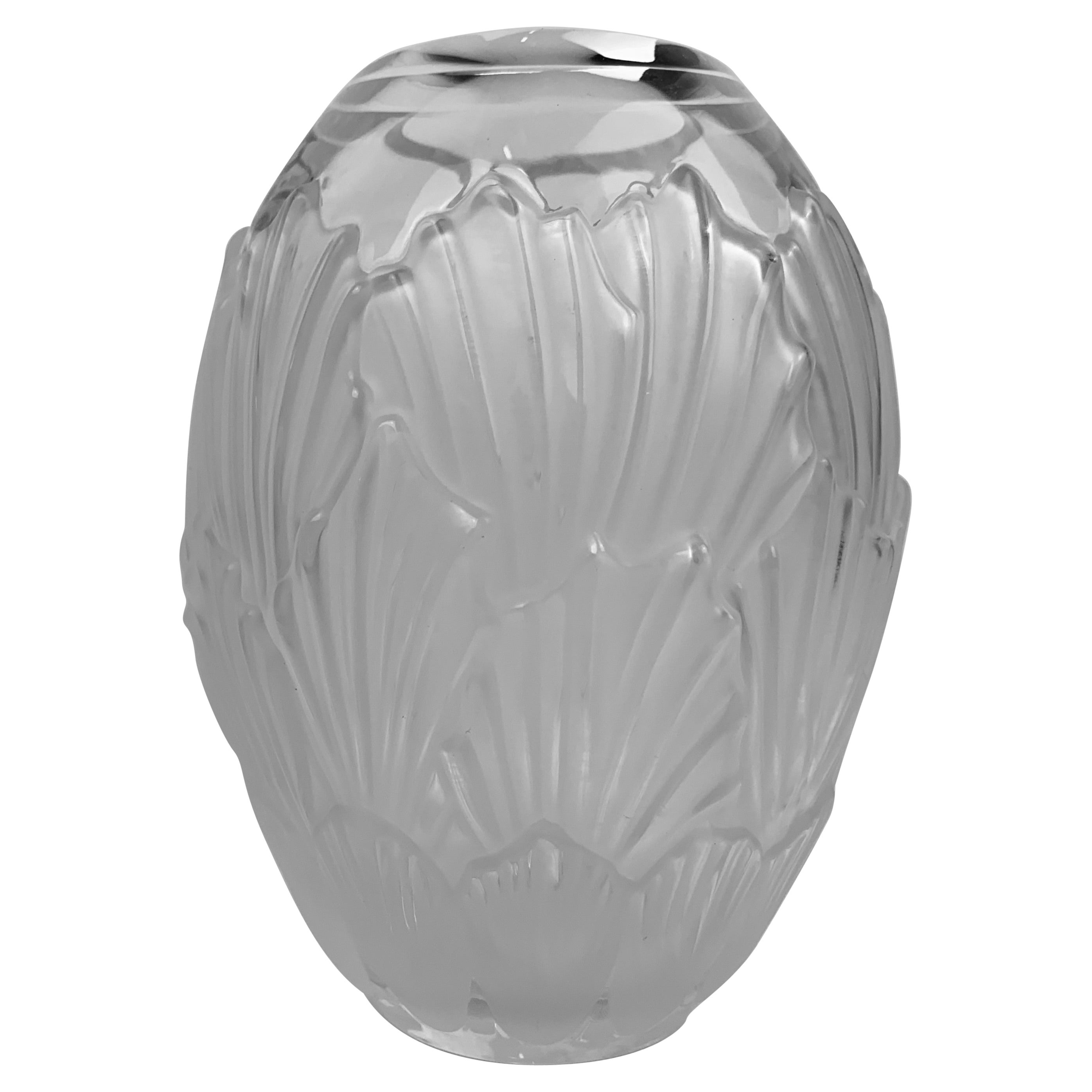 The Lalique frosted glass Sandrift vase was produced in the 1960's in the Art Deco style. It is in ovoid form with frosted overlapping shells. Scribe signed on the bottom Lalique, France.
Measures: H-8.25'
W-6