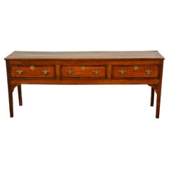 English Georgian Period 1820s Oak Sideboard with Three Drawers and Banding