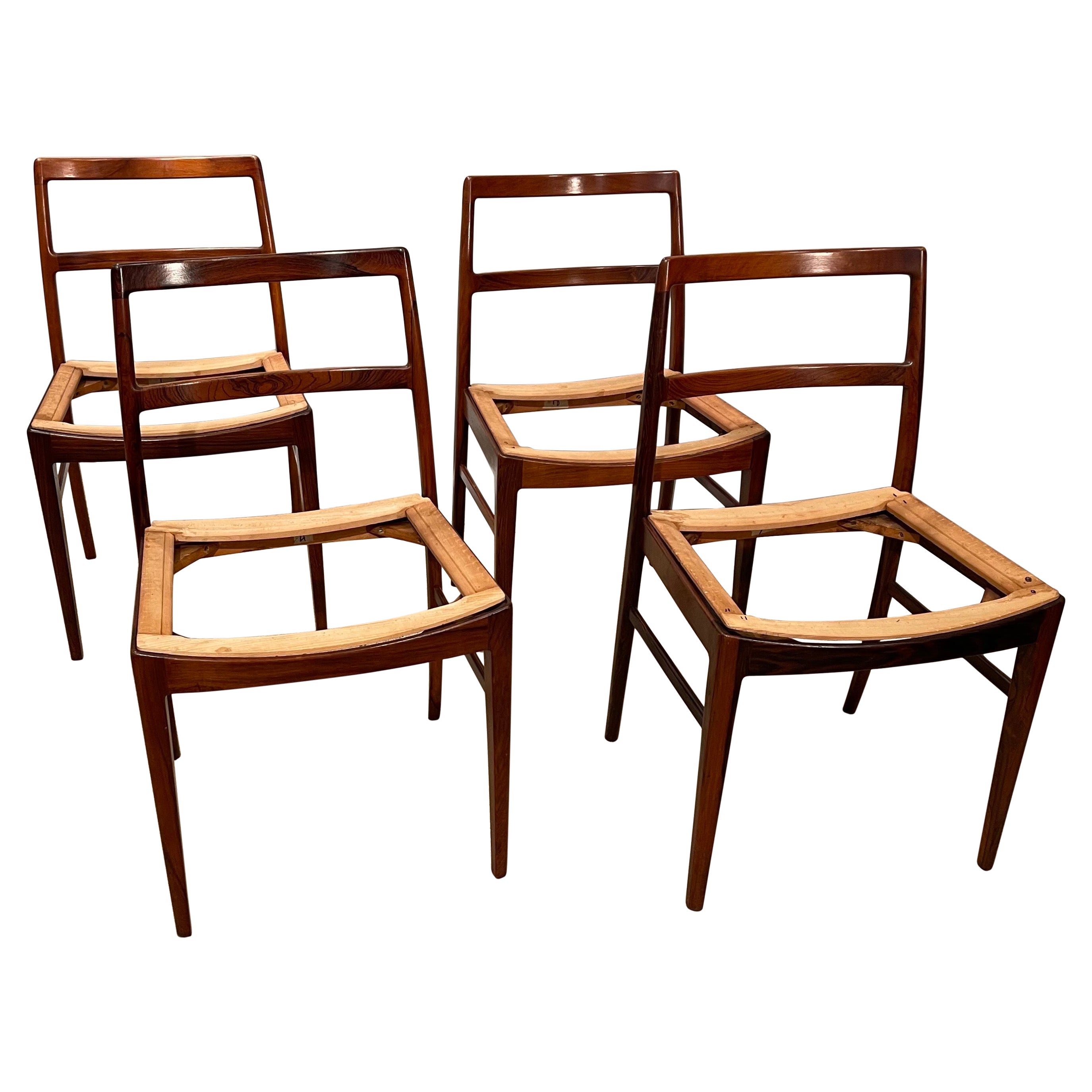 A set of 4 Mid-Century Modern rosewood side chairs with saddle slip seats
These chairs have wonderfully comfortable saddle seats 
frames tightened, with slip seats ready to upholstery. 
If you provide fabric, we can cover for $350 per seat.