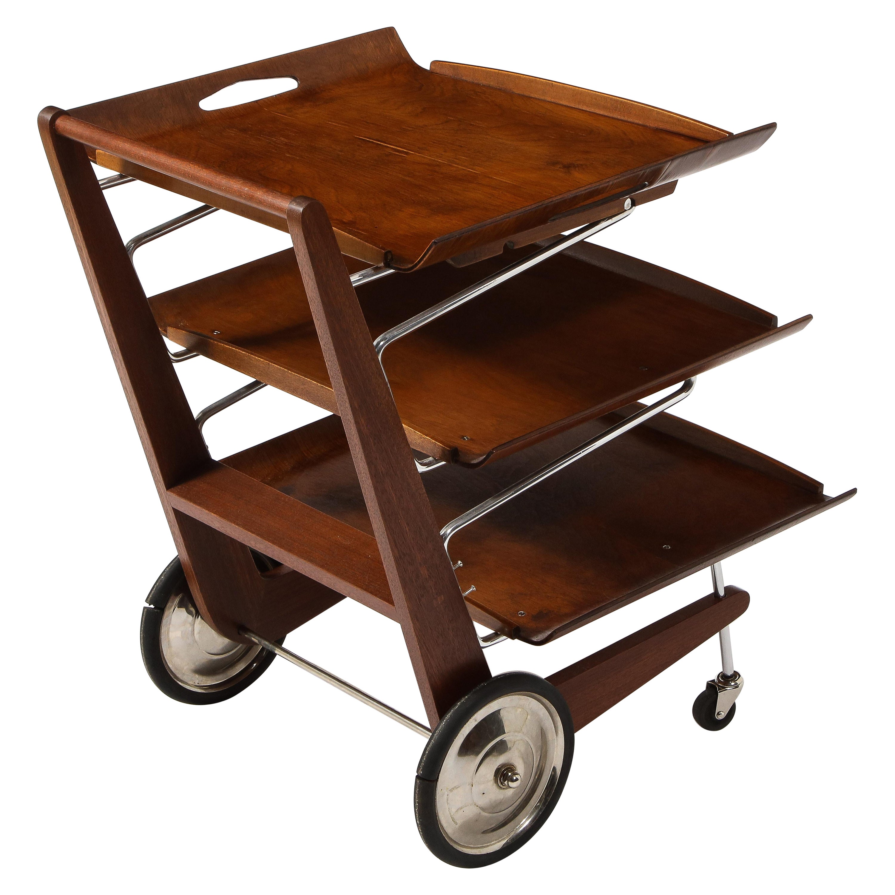 Exceptional modernist bar cart, created by a Czech architect for his house. It is made of aluminum and walnut; the trays are removable for serving. It has been professionally restored.