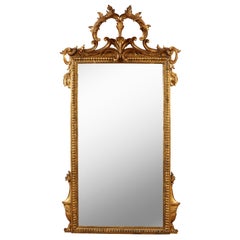 Miroir italien sculpté en bois doré