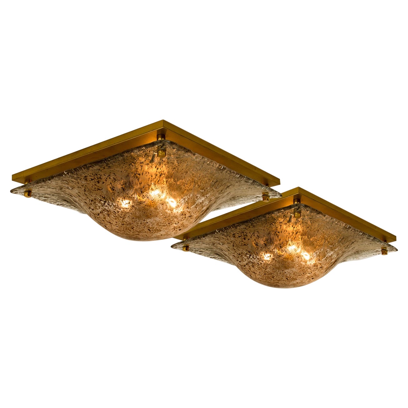 A high quality modern thick textured ice glass flush mount light by Kalmar, circa 1965. The flushmount is featuring a huge quare brown marbled blown ice glass dish. The handmade dish gives the piece a heavy ice appearance which refracts the light,