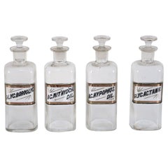 Set of 4 Early 20th Century Labeled Glass Apothecary Bottles