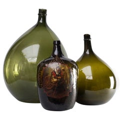 Set of Three 19th Century Italian Blown Demijohn or Damigiana Glass Bottles