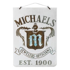 Glass Advertising Plaque, “Michaels Jewelers And Opticians”