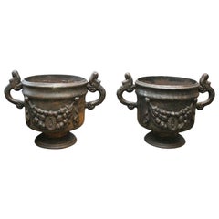 Pair of Ornate Cast Iron Urns