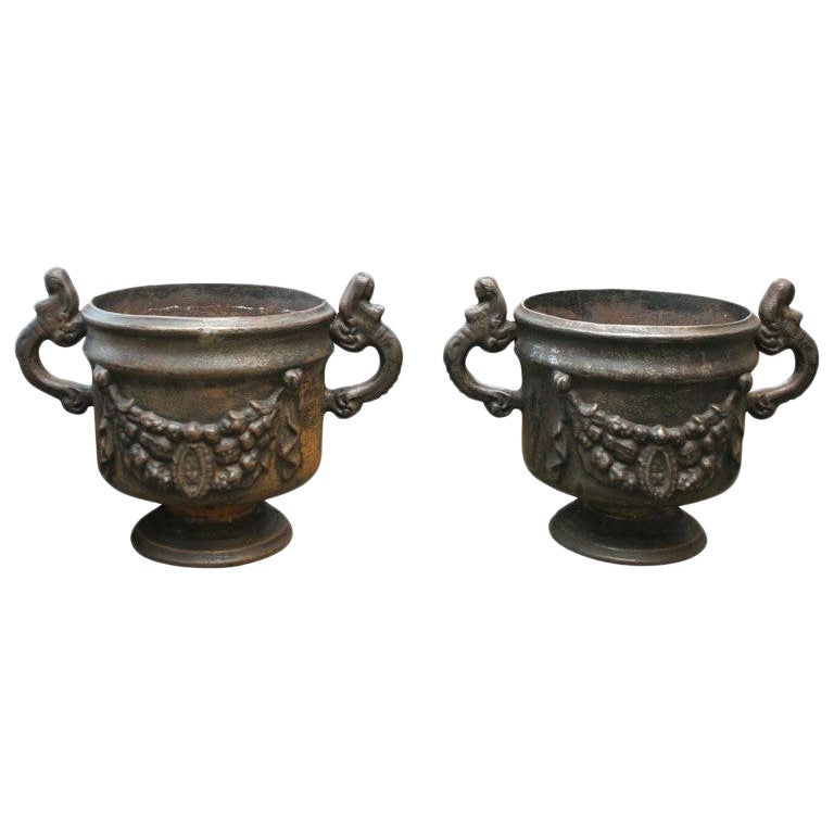 Pair of Ornate Cast Iron Urns For Sale
