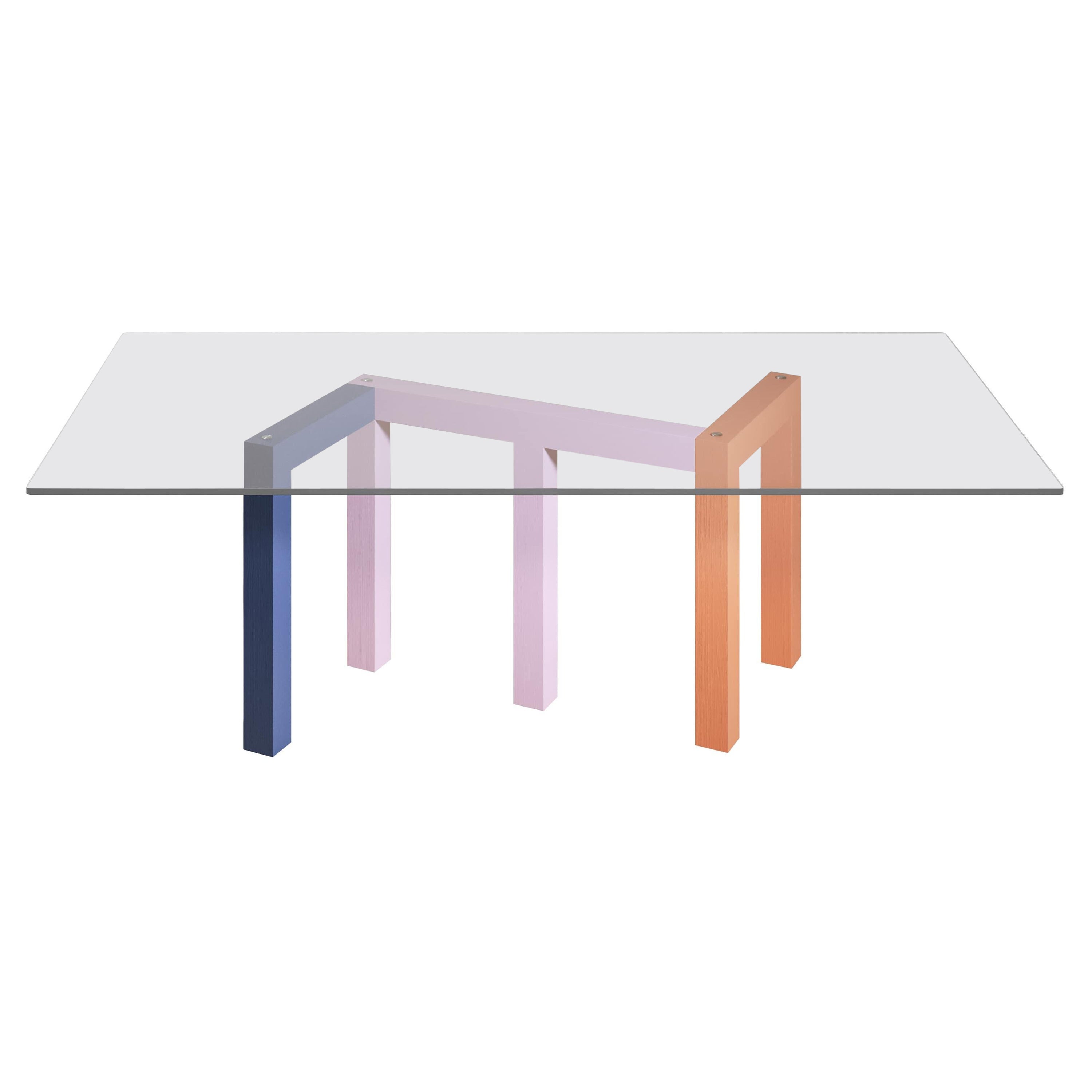 Table de salle à manger Penrose pieds en frêne bleu, rose et orange, verre transparent