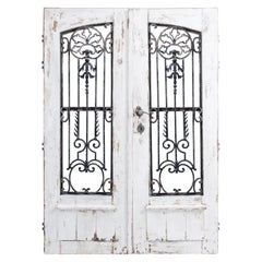 1900s French Country Doors with Wrought Iron Grille, a Pair