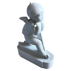 Royal Copenhagen Figurine, Cupid on Scooter No 12477