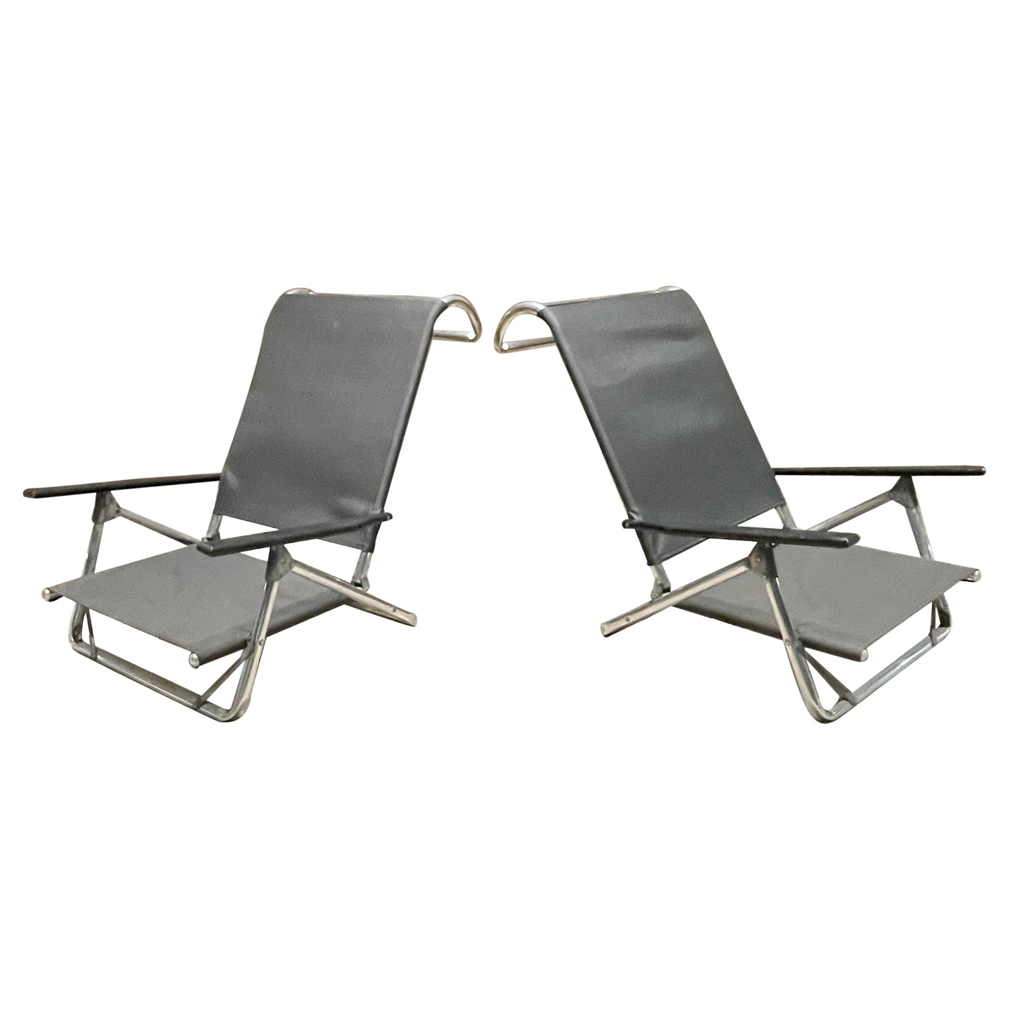 Eye catching modern by TELESCOPE of Granville New York, pair of modern beach patio folding chairs aluminum with wood arm handles.
Ideal for Beach Patio Pool Boat Outdoor Lawn Sun Picnic Parties! Be in style.
Seat height angle can be adjusted as