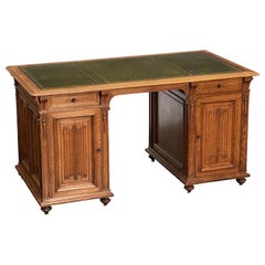 English Pedestal Desk of Oak with Leather Top from the Edwardian Era