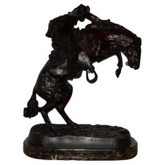 sculpture en bronze "Bronco Buster":: d'après Frederic Remington