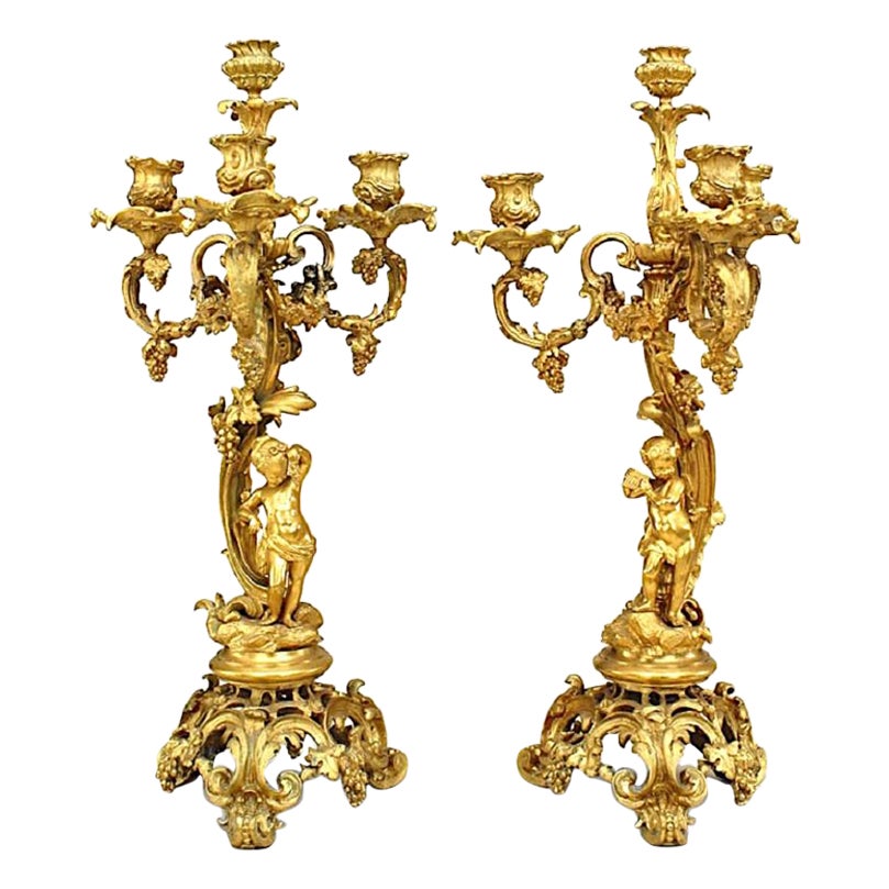 Pair of French Louis XV Style Bronze Dore Four Arm Cupid Candelabras