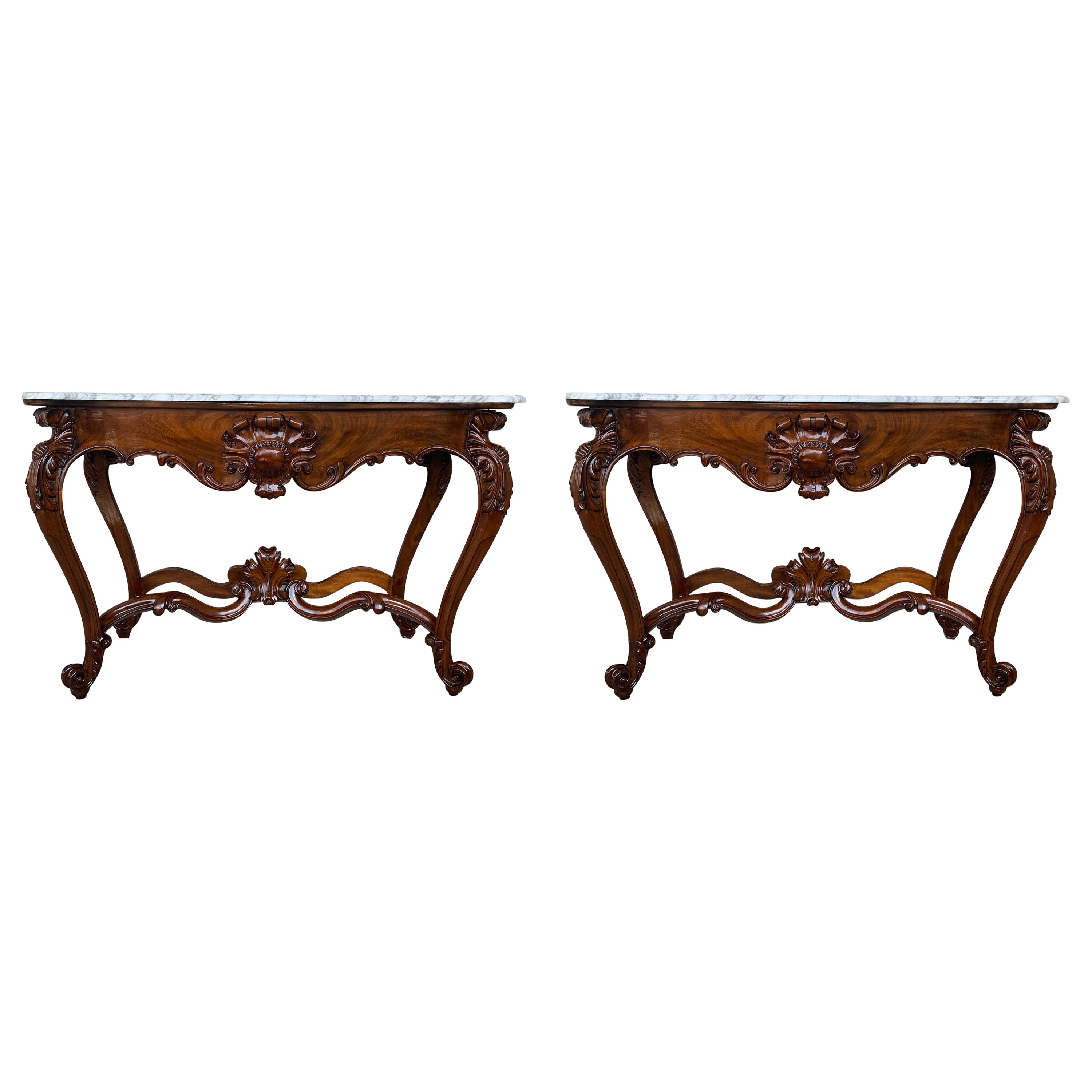 19th French Regency carved walnut console table with marble top

19th century French Regence style beautifully carved with leaves walnut console. White marble top with carved front, over hand-carved frieze supported by four cabriole legs connected