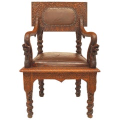 Antique Burmese Carved Oak and Leather Armchair