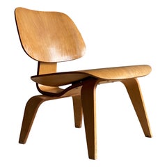 Fauteuil de salon vintage en bois Eames LCW pour Herman Miller