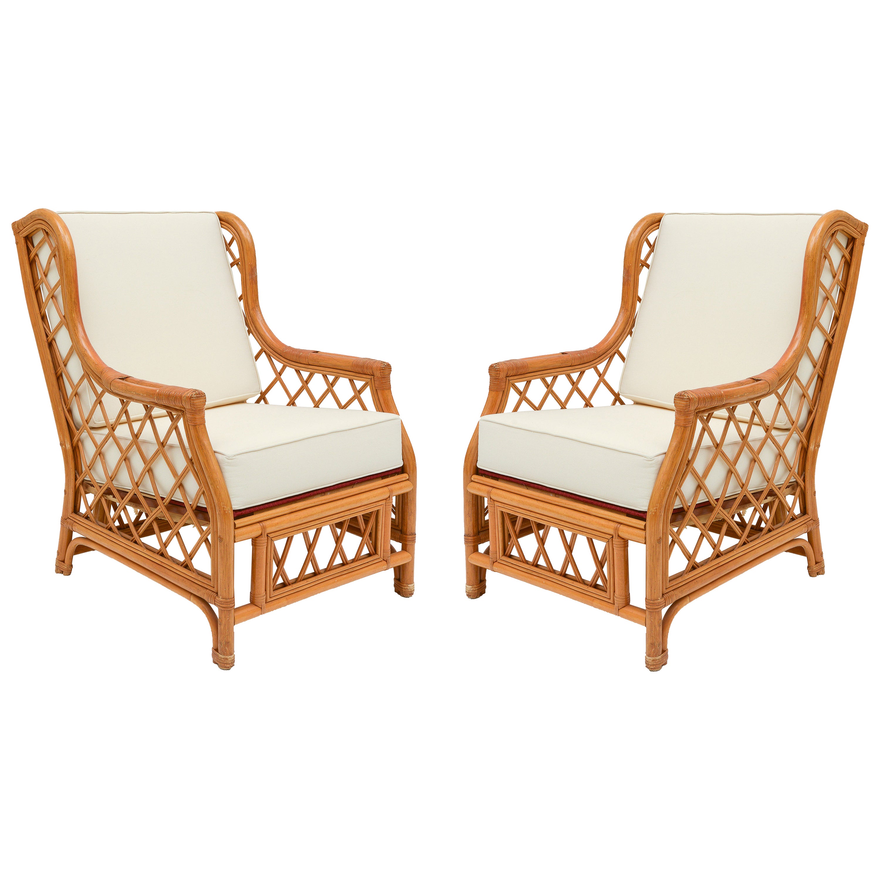 Beautiful pair of bamboo rattan pair of vintage club chairs with newly made white cushions. Large scale chair with incredible detailing throughout. France.