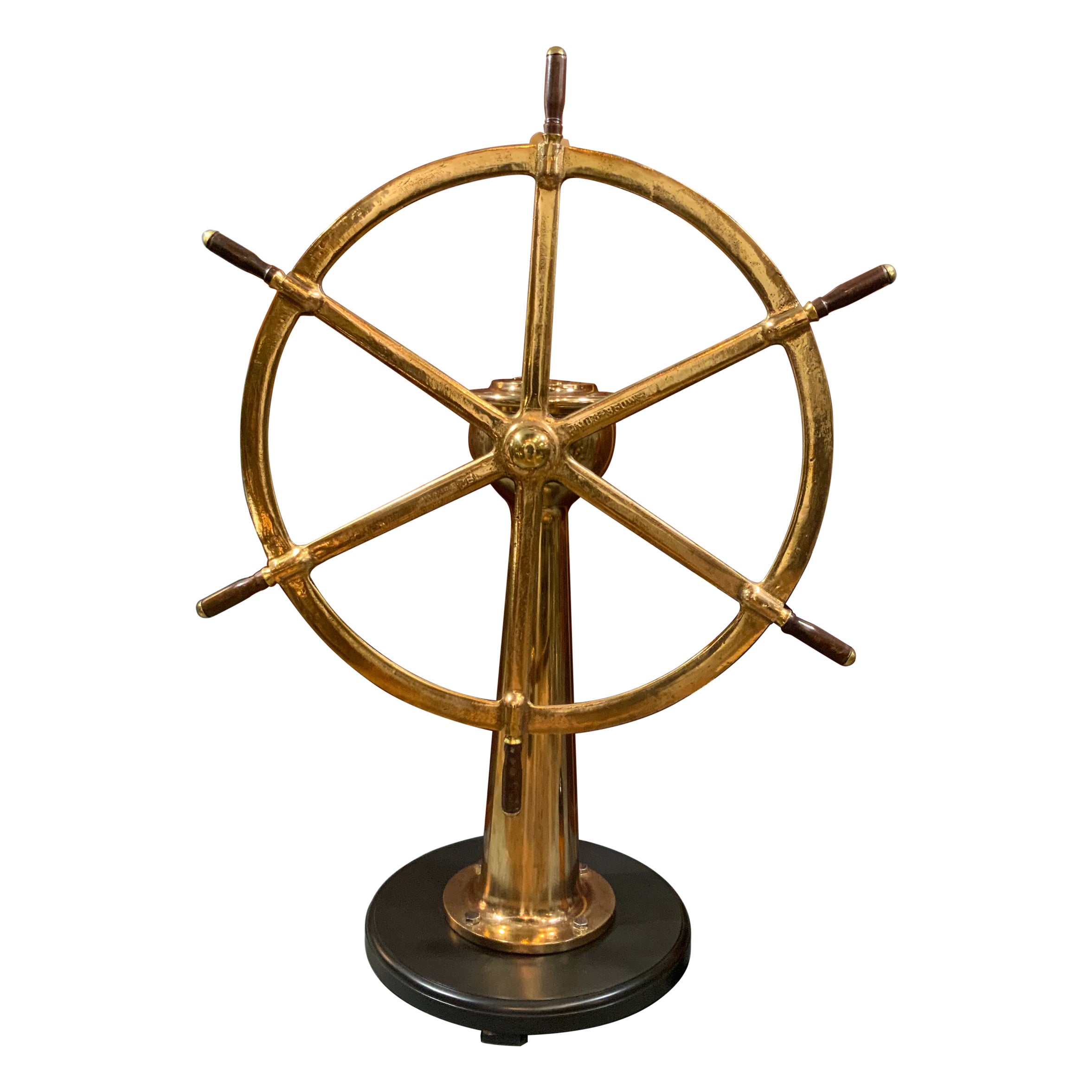 Solid Brass Ships Wheel Mounted Onto A Substantial Brass Pedestal