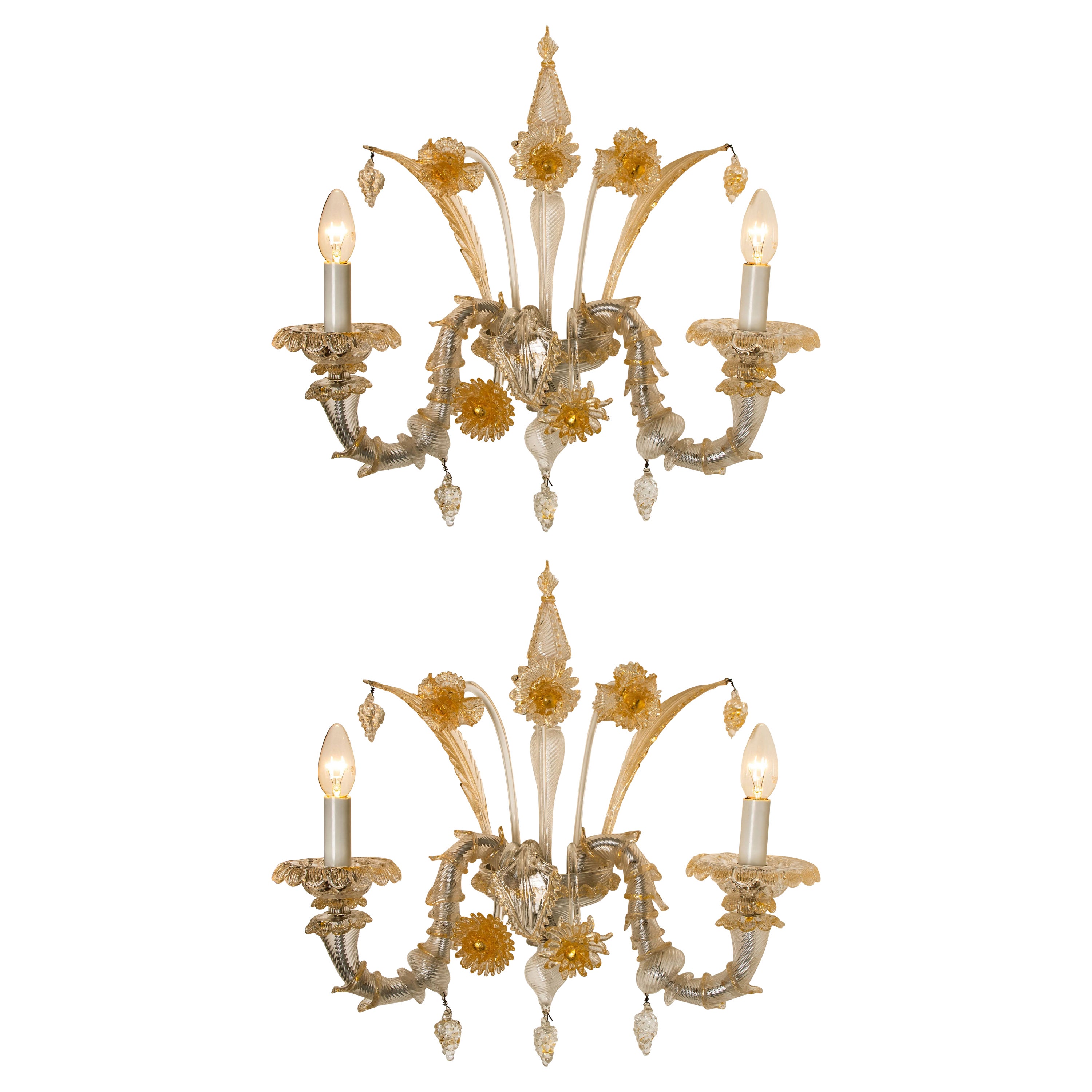 A truly rare and outstanding pair of wall lights, the lights are handmade in ribbed and curled colorless glass with aventurine inclusions. Statement pieces. Beautiful craftsmanship, Venice, Murano, circa 1960.

With grey metal mounting, central