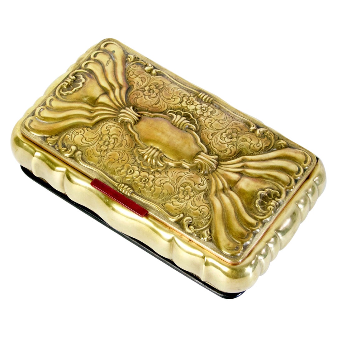 Trinket/jewelry box with a hinged lid made in Italy from brass. The lid is chiseled with an intricate pattern and the inside is covered in silk velvet. All in good original conditon.