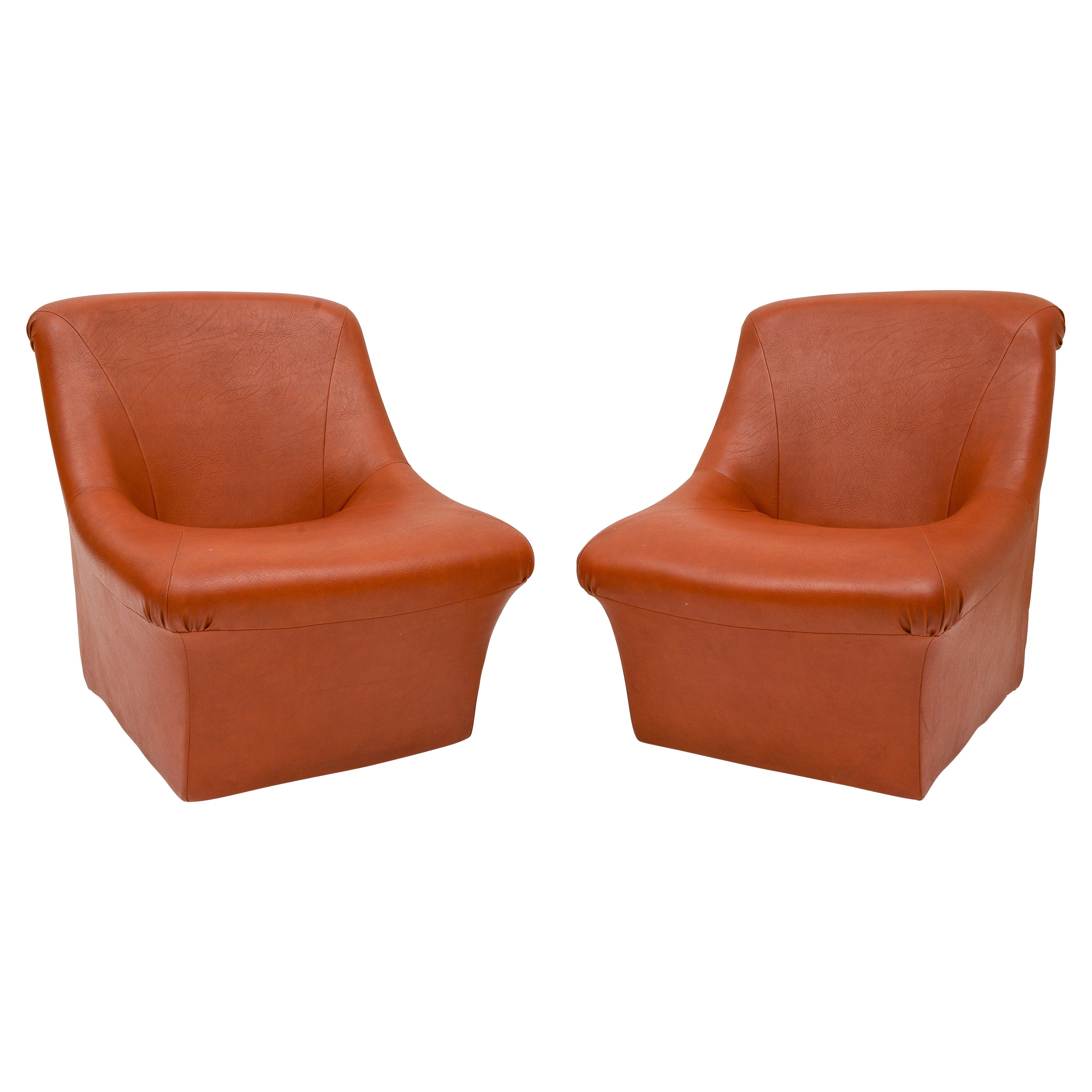 70's brown cognac leatherette pair of chairs, cool and stylish. They are very comfortable. Imported from France.