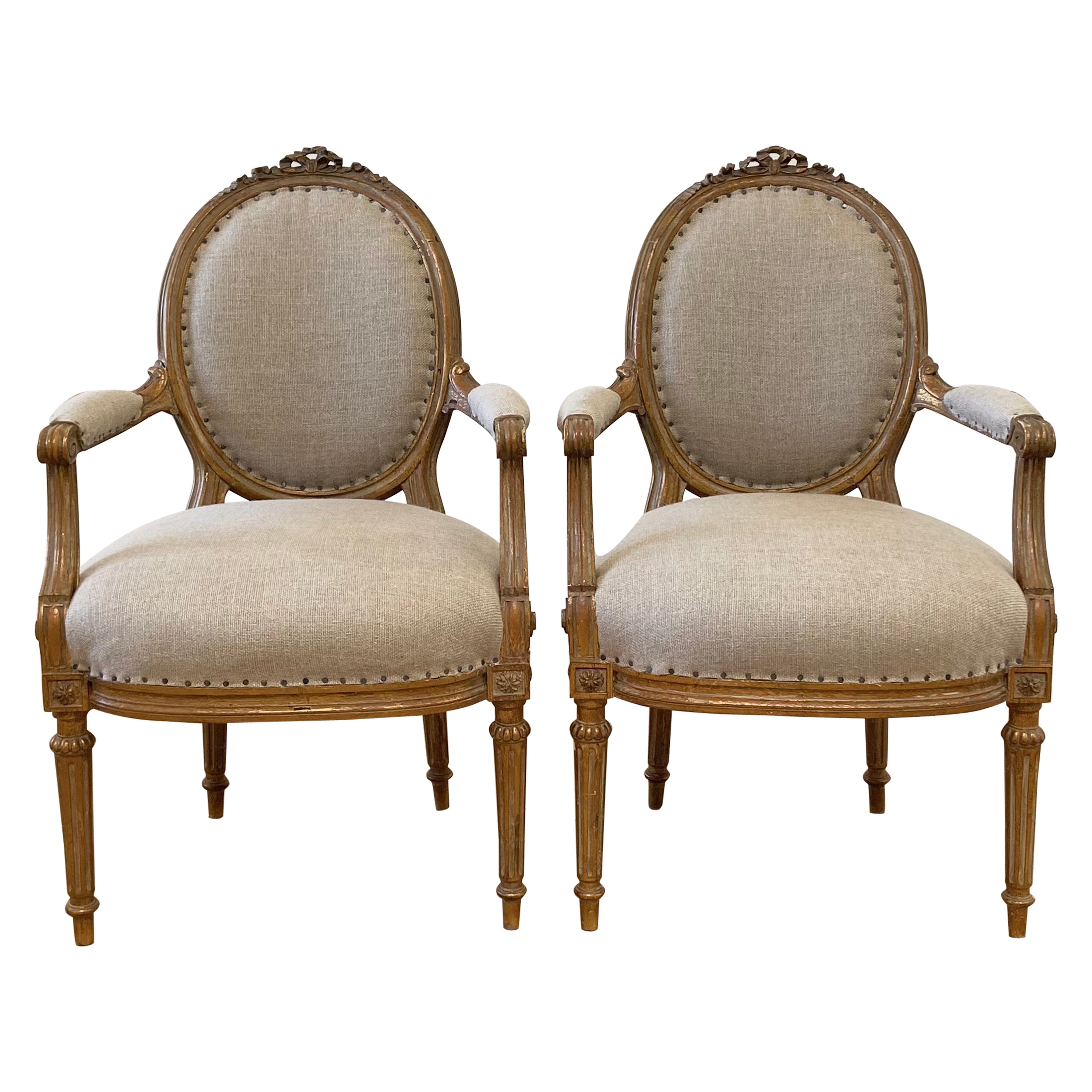 Antique Pair of Gilt Wood Open Arm Chairs Upholstered in Natural Linen For Sale