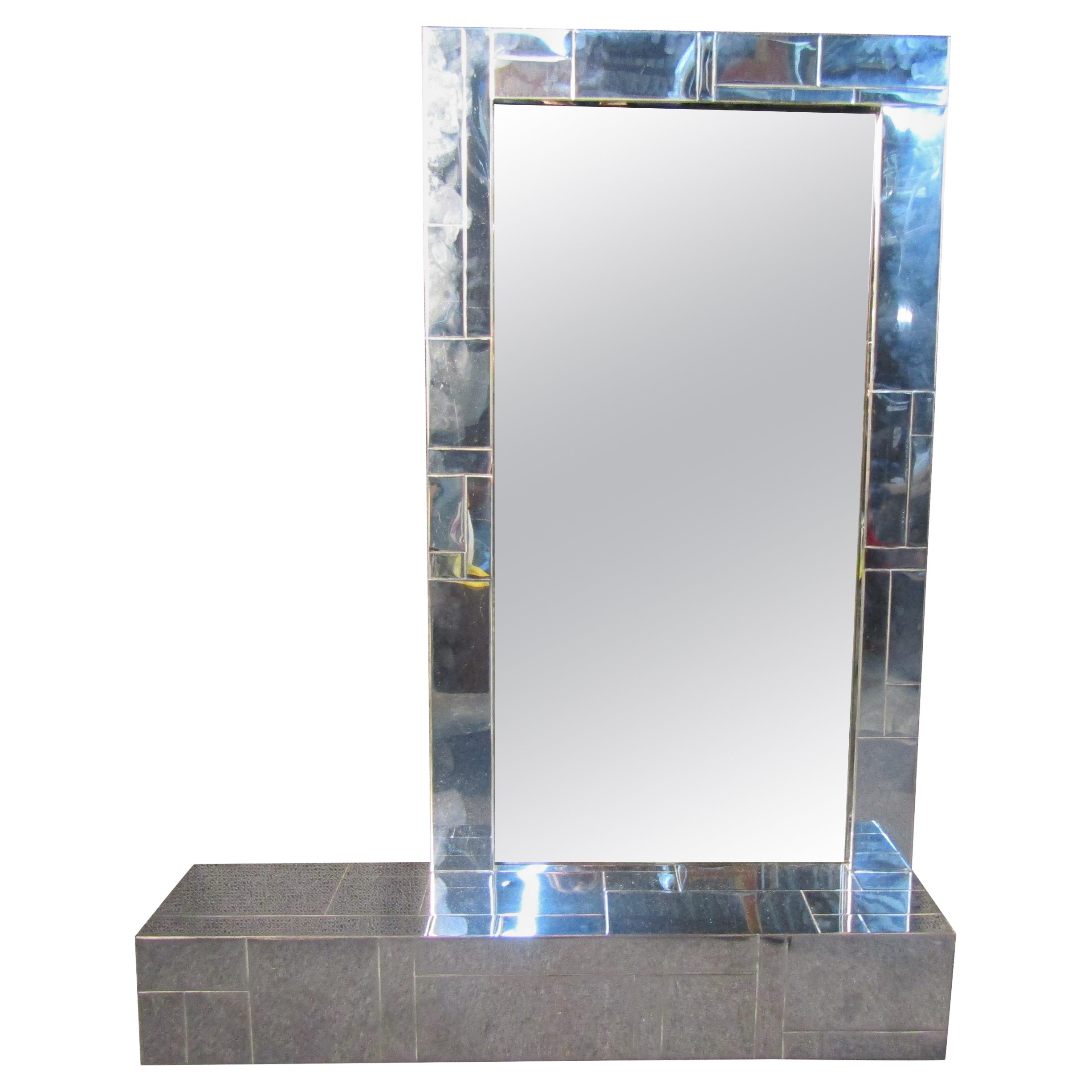Mid-Century Modern Paul Evans mirror featuring a geometric designed shape that allows this wall mirror to be used as a shelf as well.

(Please confirm item location NY or NJ with dealer).
  