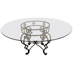 Table de salle à manger ronde de style baroque avec base en métal et plateau en verre