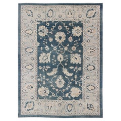 Grand tapis turc Oushak avec fond bleu sarcelle fonc et bordure bleu glace