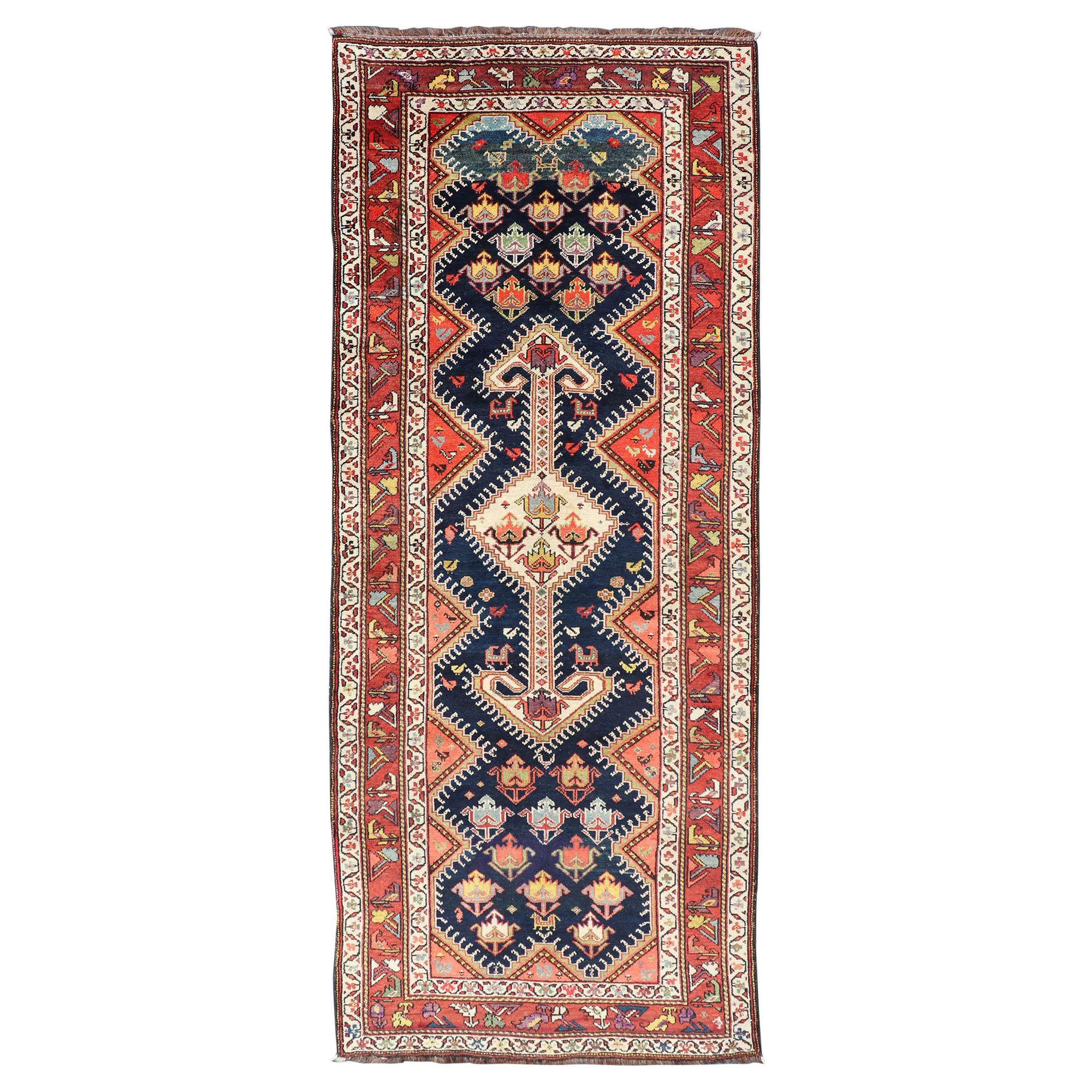 Antique Persian Qashqai Runner with Geometric Medallion Design in Vivid Colors  For Sale