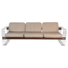 Stendig Sofa with Polished Steel and Sculptural Wood