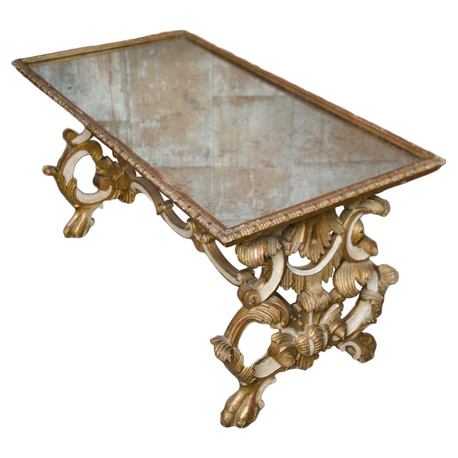 Richly Carved Mirror Top Giltwood Coffee Table, French, nineteenth century.