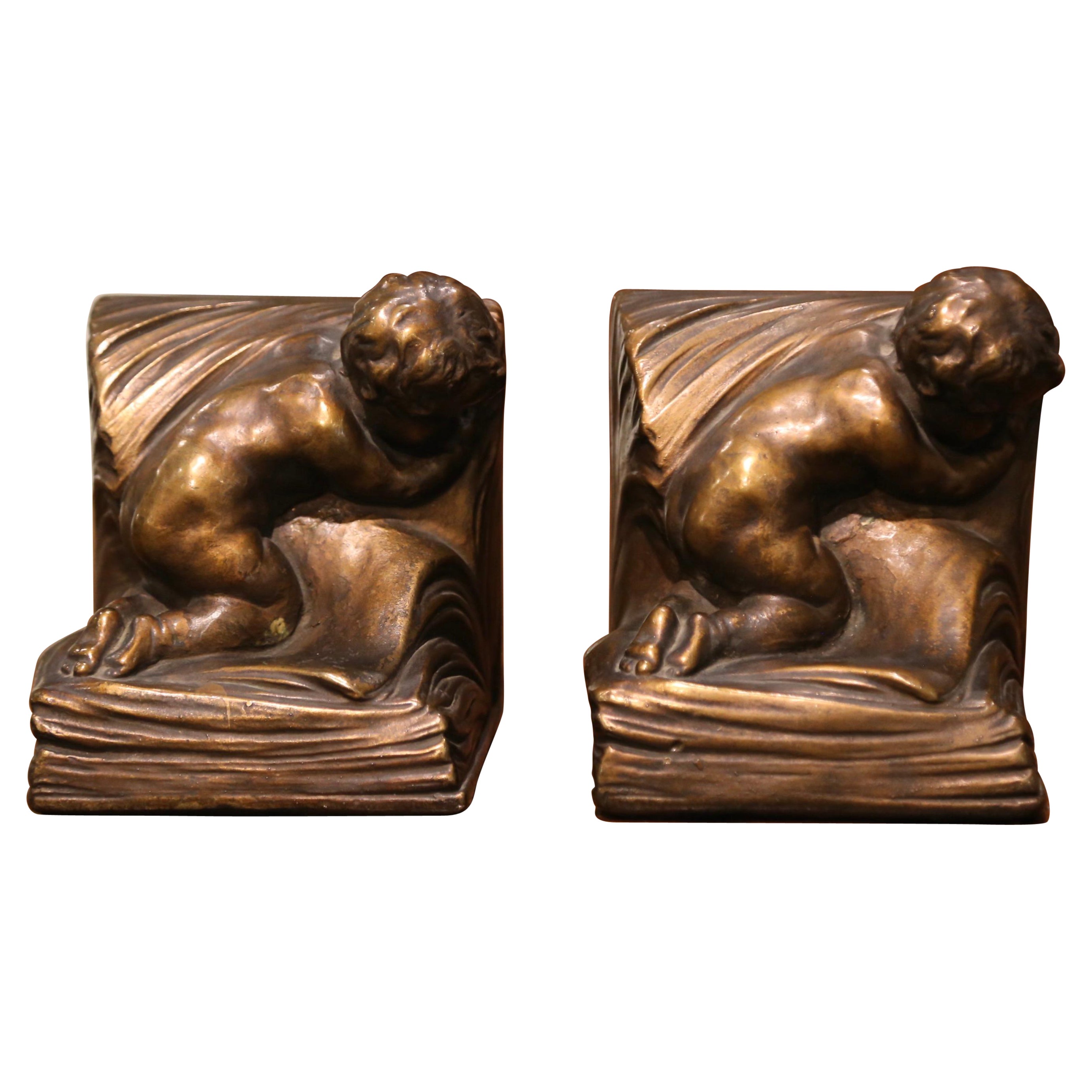 Pair of Patinated Armor Bronze Cherub Bookends Signed and Dated CA Johnson 1914