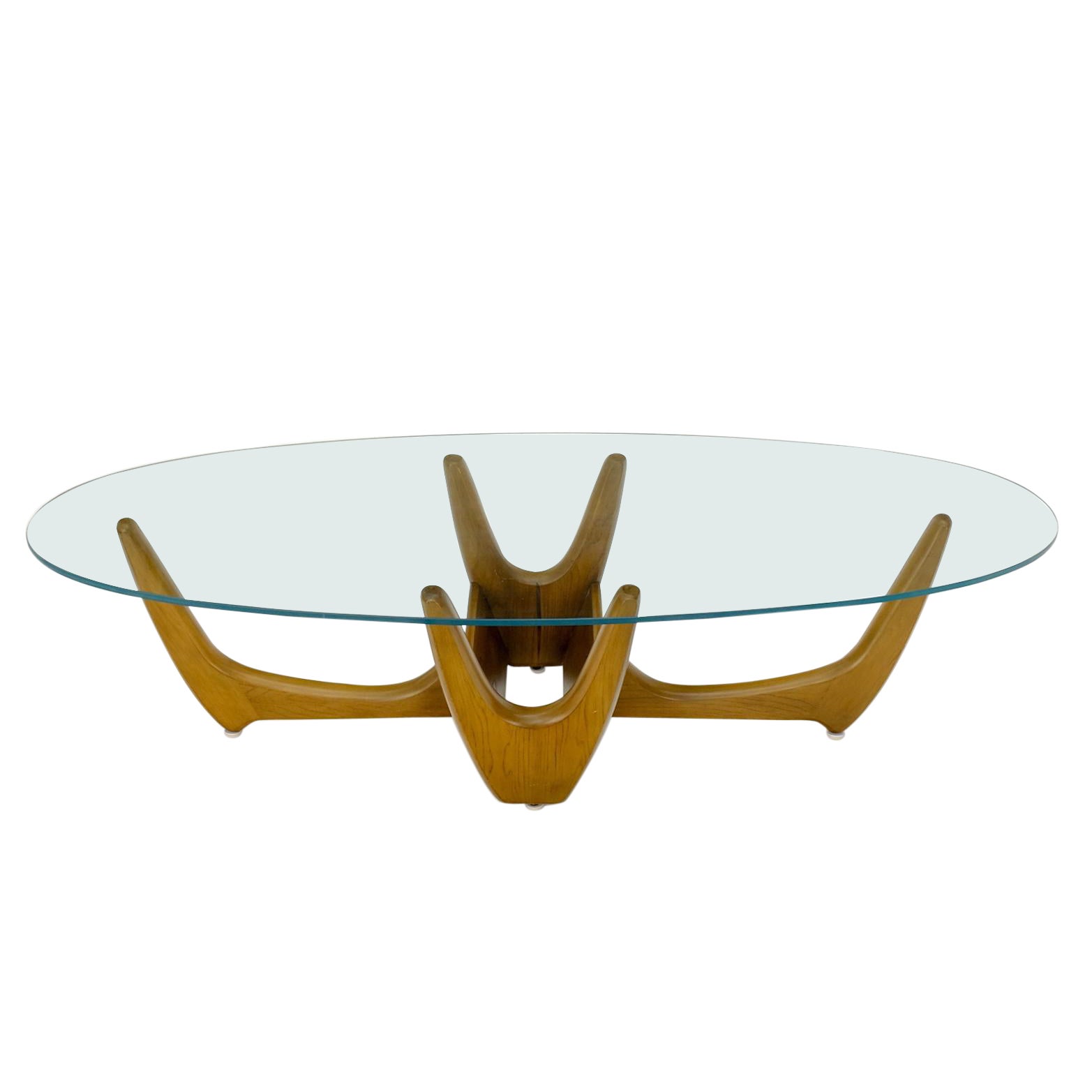 Grande table basse ovale à plateau en verre et bois massif sculpté 