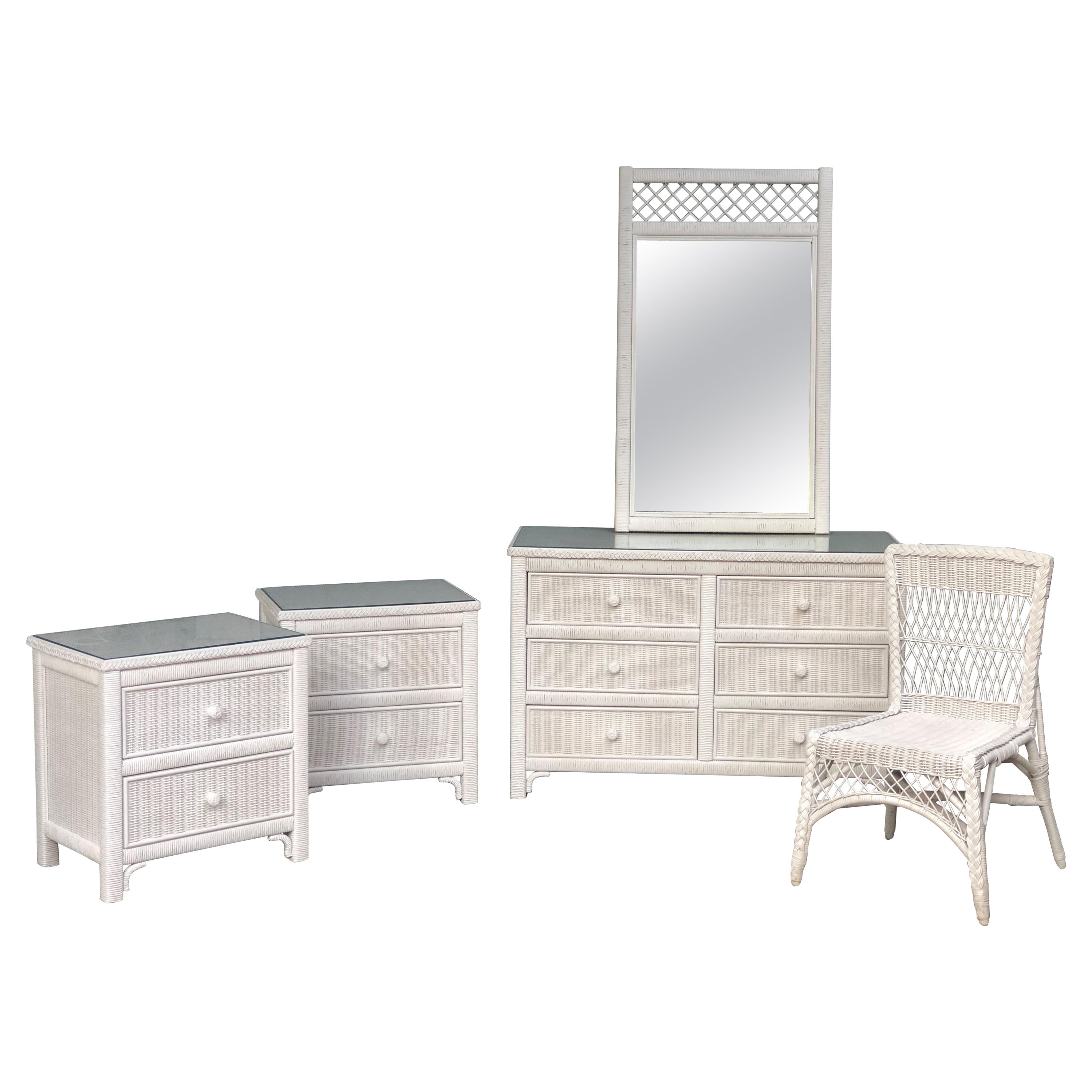 Rare set of white wicker Henry Link Bedroom Furniture, including Nightstands x 2, Chest of Drawers,
Wall Mirror and chair.  Solid wood structure, with woven wicker. 

Set comprises of:
- 2 x 2 Drawer Bedside Tables / Nightstands
- 6 Drawer Chest of