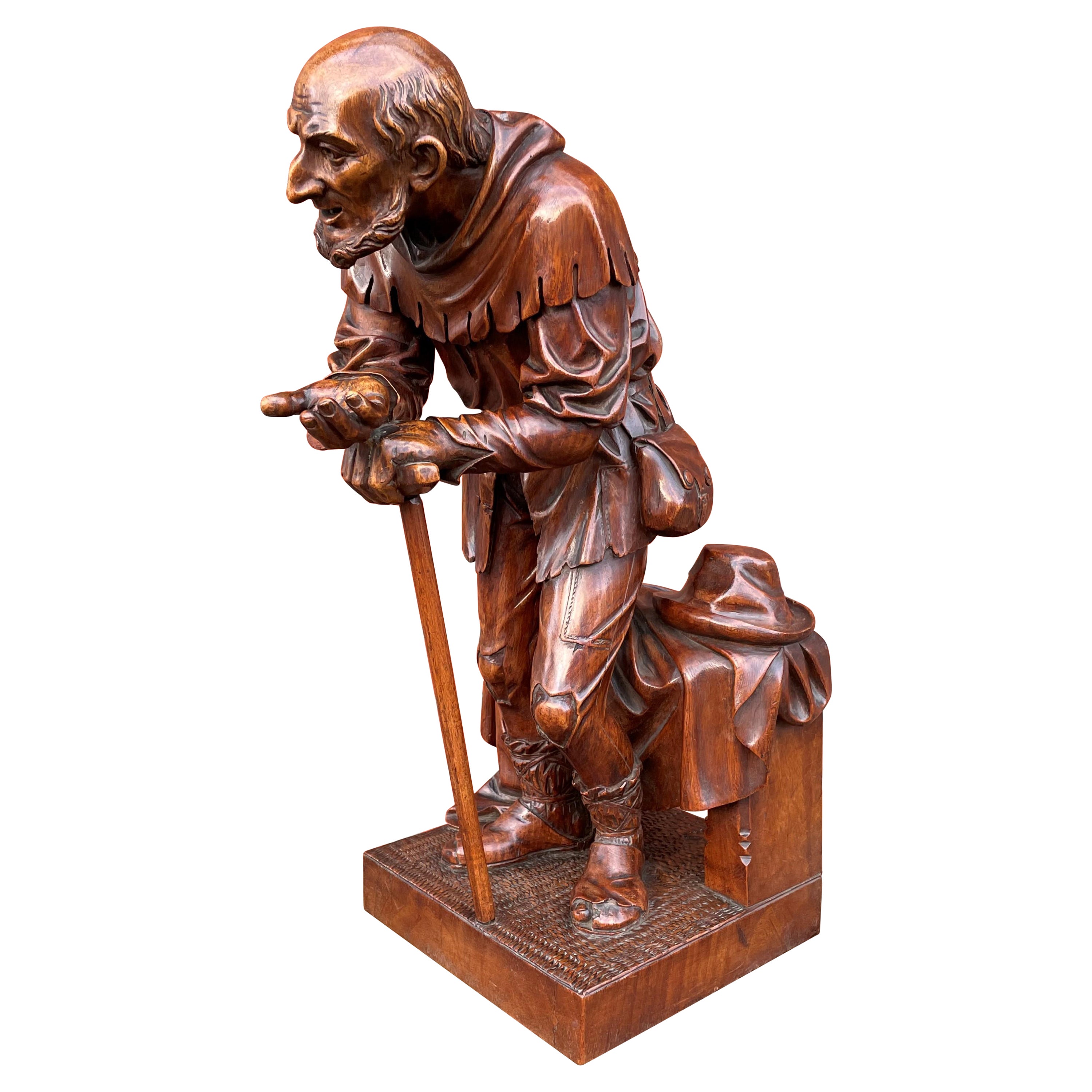 Antike, handgeschnitzte Beggar-Skulptur aus Nussbaumholz in Schweizer Schwarzwaldqualität, höchste Qualität