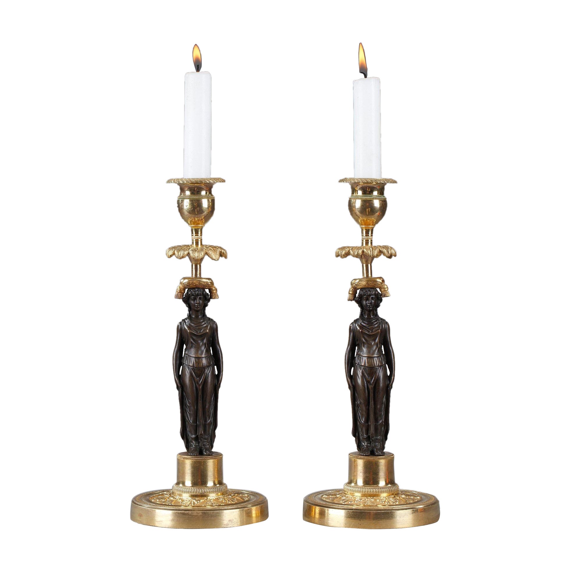 Pair of Candlesticks in Patinated and Gilded Bronze