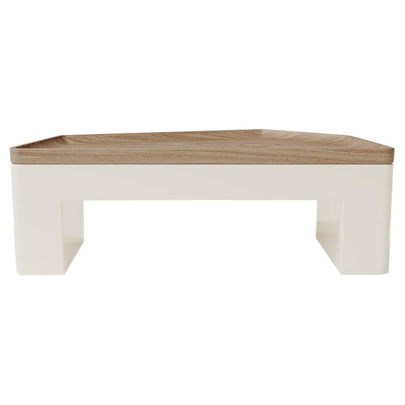 The Contemporary Modern Minas Small Center Table by Caffe Latte uses in this version beech wood with matte and walnut light on top over a cream lacquered base. With strict lines this center table has a rectangular shape but is perfect for more fluid