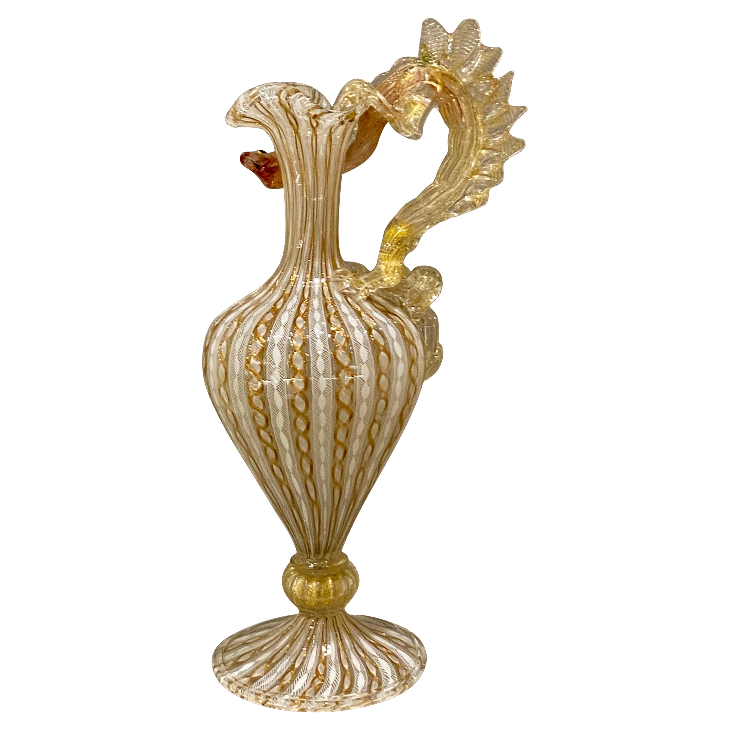 A superb quality 19th century Venetian glass claret jug - Ewer with alternating strands of opaque latticino and aventurine, the handle modelled as a dragon, 14.7 inches (37.5cm) tall by 6 inches (16.3cm) wide.
This is presented in immaculate