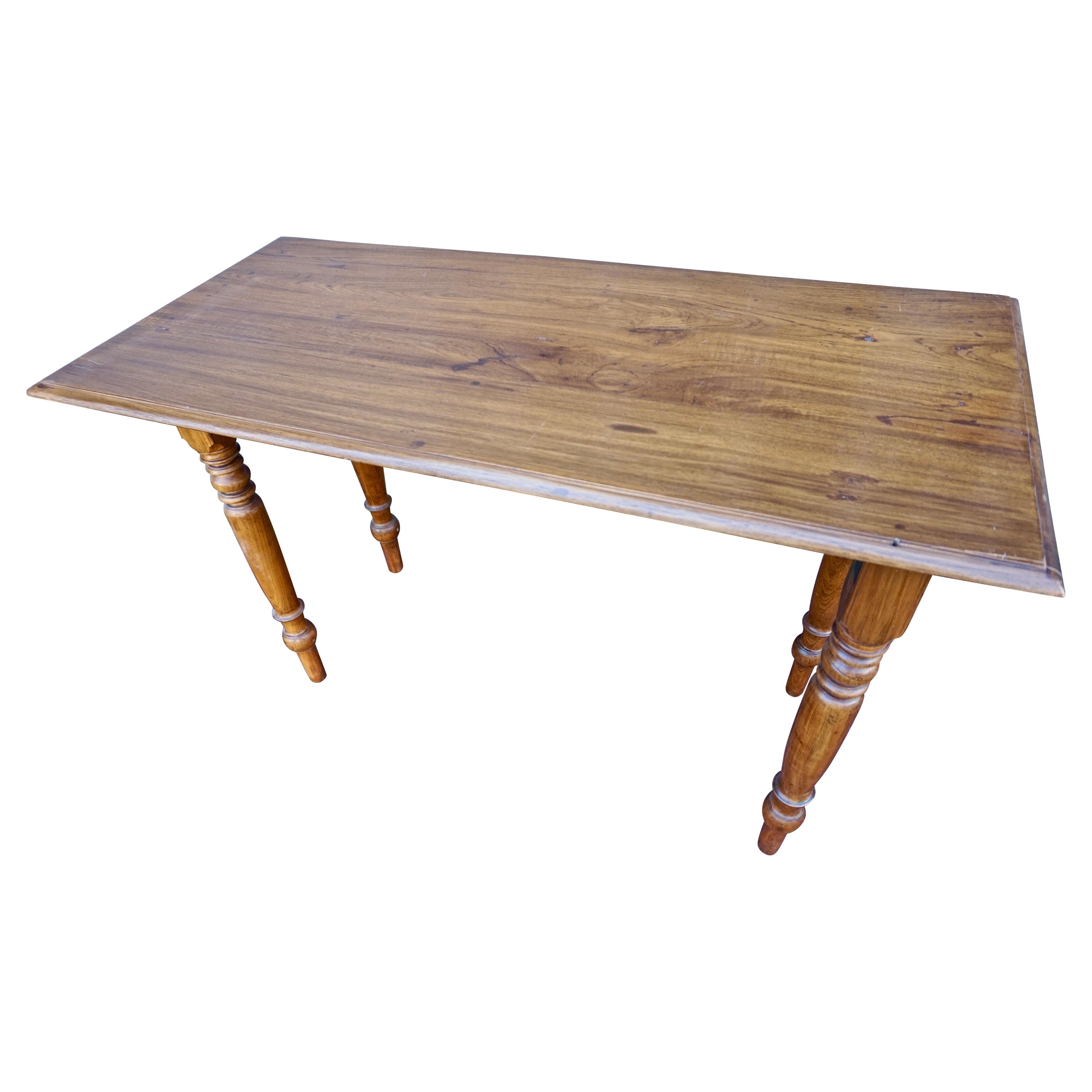Circa 1890's

Solid teak hand crafted Campaign folding table from the days of the British Raj. Has flaps that pivot outwards and tuck away beneath as demonstrated. Overall good condition. Hinges seem old but re-enforcing steel plates and newer