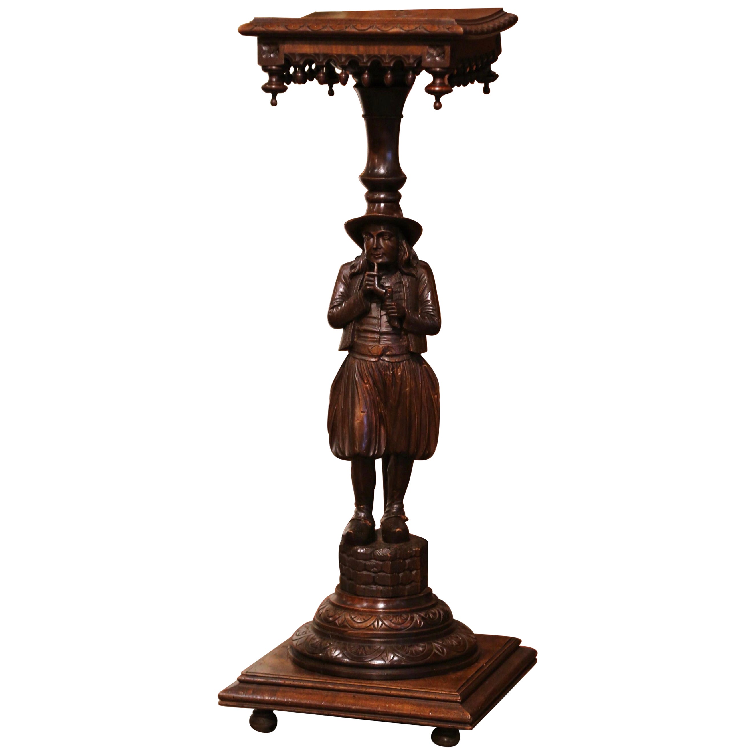 19th Century French Carved Chestnut Pedestal Table with Breton Man Figure