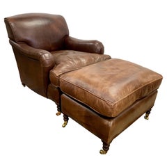 Rare fauteuil club en cuir brun signé George Smith avec pouf