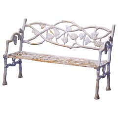 Early 20th Century French White Painted Cast Iron Garden Bench with Vine Motifs